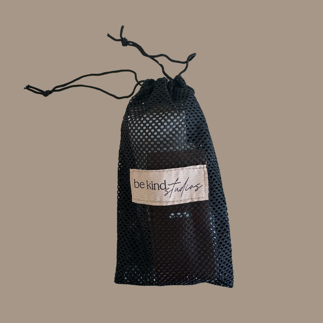 booty bands in mesh bag with the logo "Be kind studios" embroidered on the front