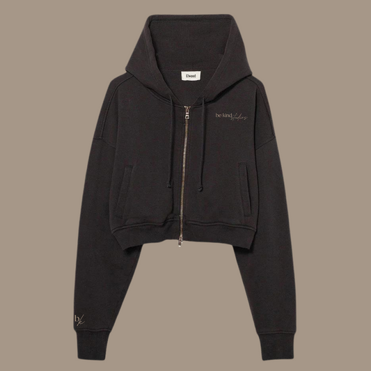 Crop zip hoodie with the words "be kind studios" embroidered on the front.