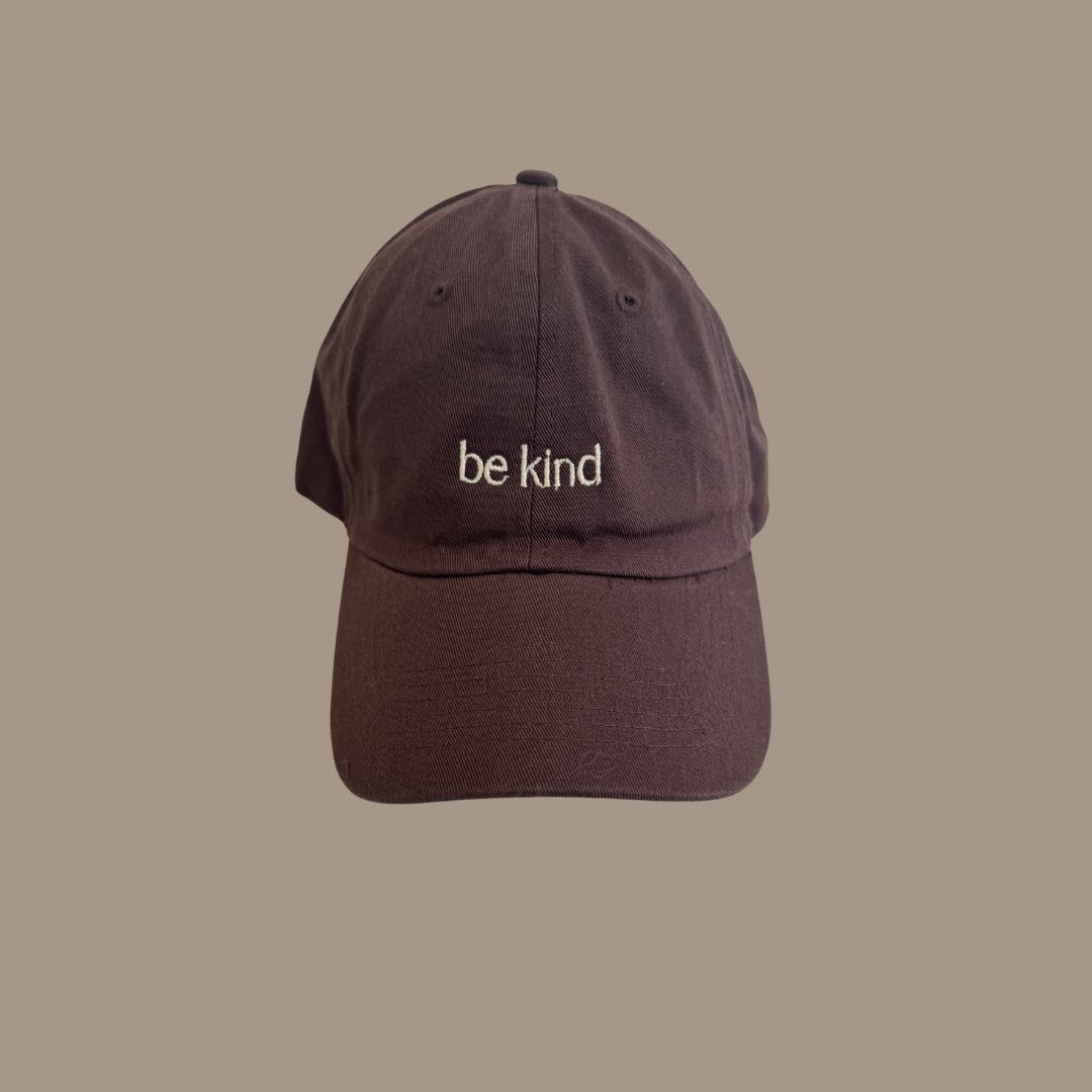 Dad hat with the words "be kind" embroidered on the front.