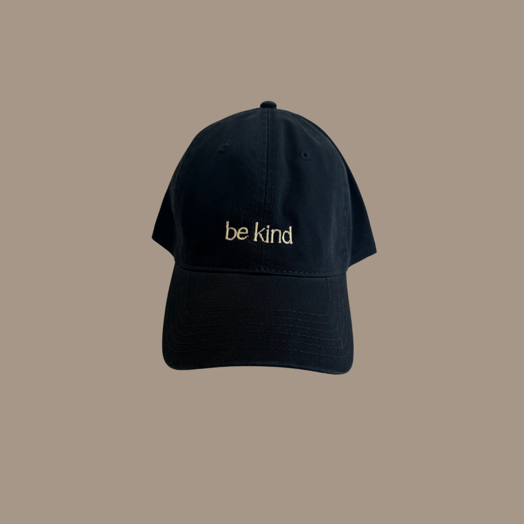 Dad hat with the words "be kind" embroidered on the front.