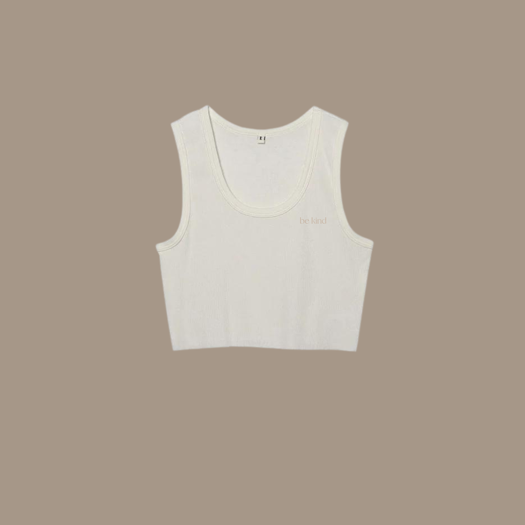 Crop tank with "be kind studios" embroidered on front